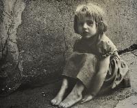 Claudia Sitting by Wall