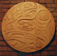 Untitled (yellow cedar laminated circular panel (raven, frog, human design))