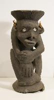 Dark Hardwood Male Figure, Resting on Hand with Shell Eyes