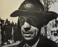 Arnold; Janitor in Nina's Building