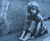 Claudia Sitting by Wall