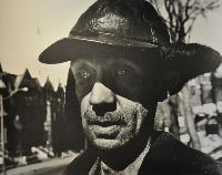 Arnold; Janitor in Nina's Building